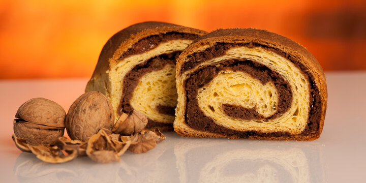 Local slovenian dessert sweet potica with wallnuts and raisins - banner size