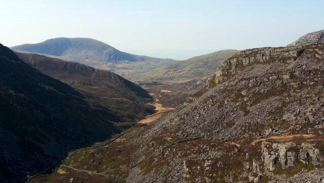 Rising aerial view of a rocky Welsh mountain valley in North Wales