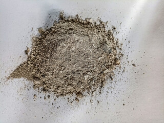 Bucket full of ashes as natural fertilizer. Outdoor shot.
