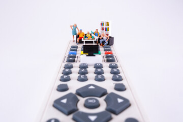 Family spending time together channel surfing and watching a television, conceptual photography....