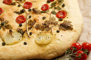 Floral painting focaccia, italian garden flatbread art with parsley, tomatoes, onions, sesame seeds...