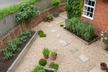 Foto op Canvas Landscaped garden design with gravel and raised beds, UK © Paul Maguire