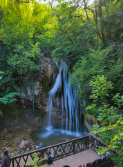 beautiful waterfall in the mountain gorge