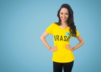 Portrait of caucasian woman wearing brazil shirt against copy space on blue background