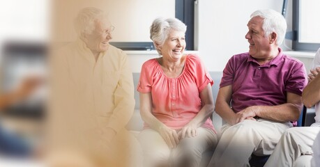 Blur effect with copy space against group of caucasian senior people smiling at retirement home