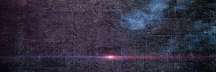 Spots of light over grey brick wall background with copy space