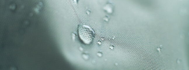 waterproof fabric with waterdrops. non woven fabric water texture background Water drops on...