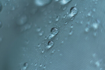 waterproof fabric with waterdrops. non woven fabric water texture background Water drops on waterproof nylon fabric. soft focus