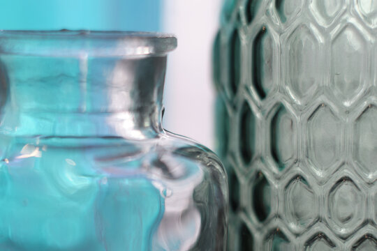 vase on white background reflecting shine and shadow. Thick glass abstraction made with glass vase and glass on shallow depth of field