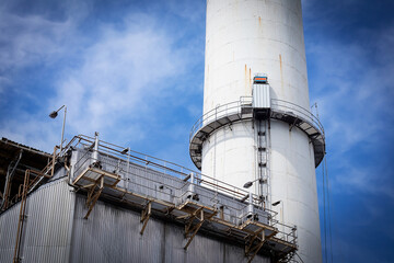 Stack chimney of the electric plant. in the picture, there is an elevator way and an elevator used...
