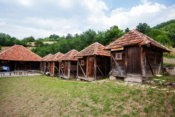 Fototapeta na wymiar Old rural traditional wooden small log cabin. Village at Serbia. Countryside landscape. Mountain Kopaonik.