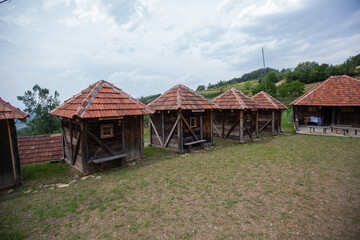 Fototapeta na wymiar Old rural traditional wooden small log cabin. Village at Serbia. Countryside landscape. Mountain Kopaonik.