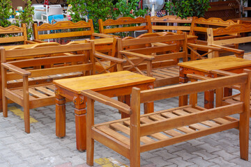 Fototapeta na wymiar Wooden empty tables with benches in restaurant.