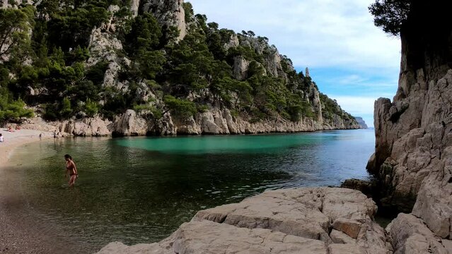 Cassis, France, October 5, 2021 - SLOW MO Calanques National Park is a French national park located on the Mediterranean coast in Bouches-du-Rh&ocirc;ne. The beach of En-Vau and its high limestone cliffs. 