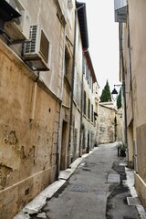 narrow street in old town of lisbon portugal, photo as a background , in arles, provence, france