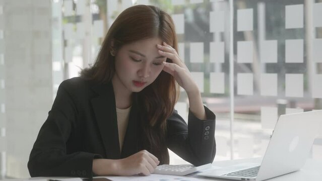 Medium shot thinkful working woman had headaches or using a lot of think. 