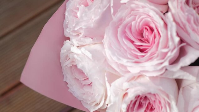 Blooming roses flowers close-up. Wedding backdrop, Valentine's Day concept. Birthday bunch. Flower Beautiful pink peony bouquet top view
