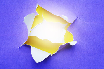 Purple and yellow background of torn paper