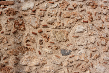Texture of old cement wall with different bricks inside. Horizontal photo.
