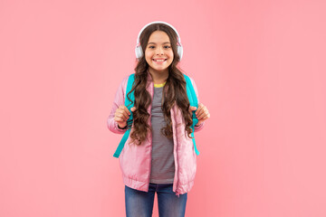 happy teen girl in headphones. listen to music. wireless headset device accessory