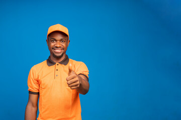 delivery employee in orange cap smiling as he did thumbs up
