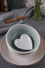 Dishes of various shapes on the table in the kitchen