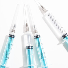 medical disposable plastic syringe for injection in the hospital isolated on a white background
