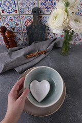 Dishes of various shapes on the table in the kitchen