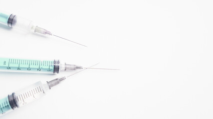 medical disposable plastic syringe for injection in the hospital isolated on a white background