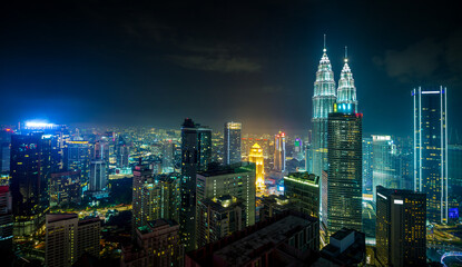 Fototapeta na wymiar Panorama aerial night view of Kuala Lumpur city skyline. Malaysia. Cool mode.