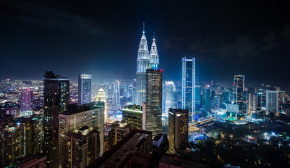 Fototapeta premium Panorama aerial night view of Kuala Lumpur city skyline. Malaysia. Blue mode