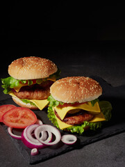fresh delicious burger on a black background