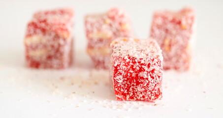 Turkish delight. Rahat lokum isolated on white background, on table.	