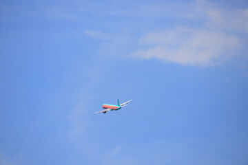 Fototapeta na wymiar Passenger airliner take off and flies in the sky