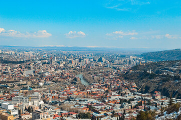 Panoramic view of the snow-covered city of Tbilisi spring