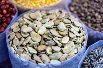 dried flat beans in a bowl