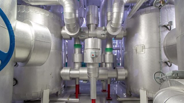 Equipment, cables and piping as found inside of industrial chiller plant room timelapse hyperlapse