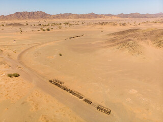 Aerial view of old abandoned Hejaz train wrecks from the Ottoman era in the Saudi Arabian desert near Medina