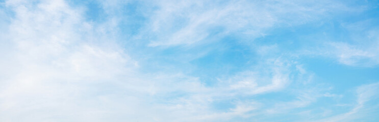 Abstract white puffy clouds and blue sky background.