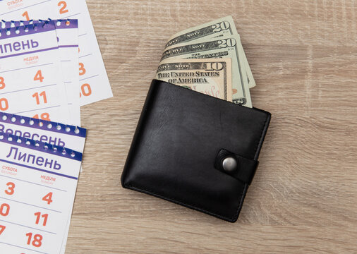 Paper Calendar And Purse With Money On Table. Travel Concept.