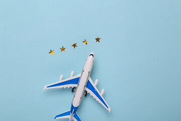 Excellent air service. Model of a passenger plane with 5 gold stars on a blue background. Travel...
