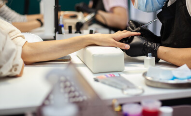 Manicurist workflow with client's nails. Nail care, manicure