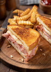 Grilled ham and cheese sandwich with french fries