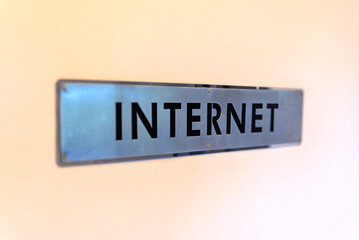 Steel plate Internet sign fixing on the wall.