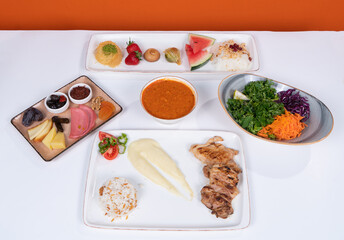 Image of dessert plate, salad, garnish, ezogelin soup and chicken grilled food in isolated environment in isolated environment.
