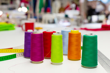 Colored spools of thread on the table