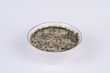 Cropped view of highland soup shot from opposite or side angle on isolated white background.