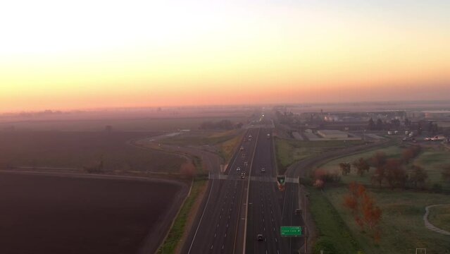 Interstate 99 freeway at sunrise. Highway going through California Central Valley, drone view.