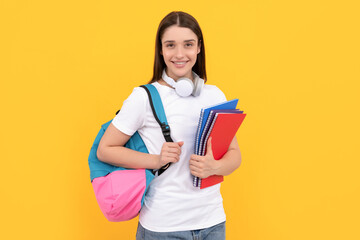 smiling lady in headphones hold copybook carry backpack, knowledge