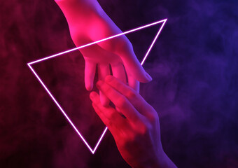 Mannequin and human hand with red-blue neon light in smoke and glowing triangle